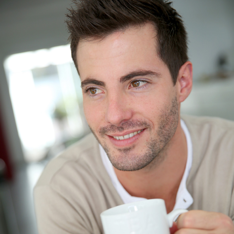 Male participant thinking about his options over coffee
